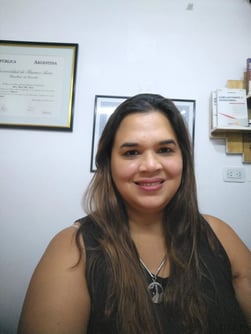 a woman with long hair and a necklace