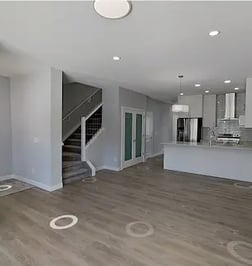 a living room with a staircase and a staircase