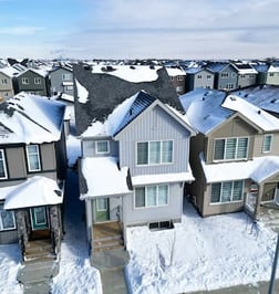 a neighborhood with a lot of snow on the ground