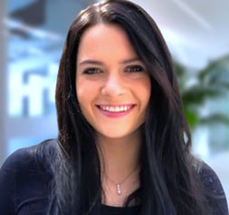 a woman with long hair and a black top