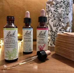 a few bottles of whitening oils on a table