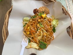 two baskets with food on a table