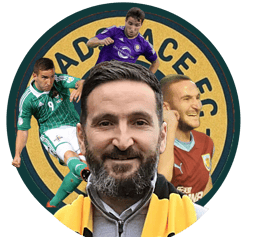 a man with a beard and a yellow jacket