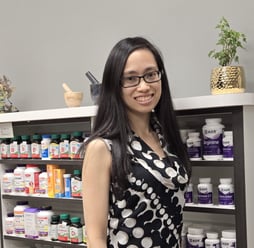 Woman with long black hair with glasses