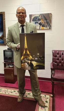 Art collector holding Summer Romance art.