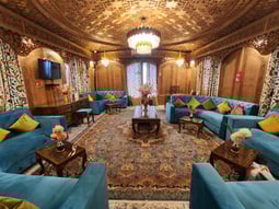 a living room with a couch and a rug in houseboat