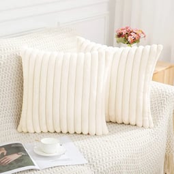 a pair of pillows with a white and black pillow