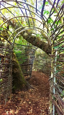 Eugene, OR - An arch tunnel made of wood on the trail at Mount Pisgah Arboretum