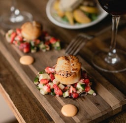 Grilled scalop with cucumber and strawberries salad and wine