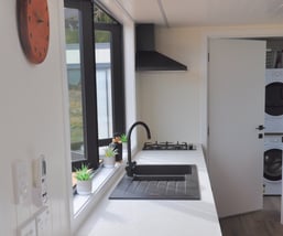 Kitchen tap, rangehood and window