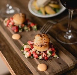 Grilled scalop with cucumber and strawberries salad and wine