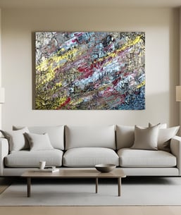 Horizontal abstract canvas above neutral sofa in modern living room, framed by white lamps on both s