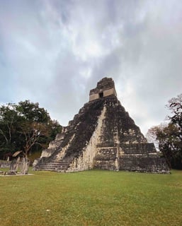 Mayan pyramids of Tikal surrounded by lush jungle, Guatemala.