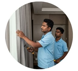 symphony maintenance and property management employee doing curtain work
