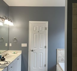 a bathroom with a shower and a shower