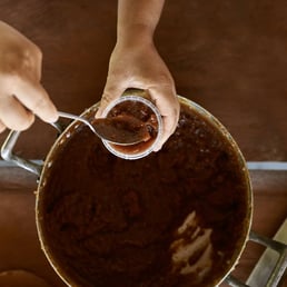 Dona Branca working on a jelly product. Taruma-Mirim - INCRA; Manaus/AM, Brazil - 2016.