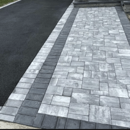 Modern turf lawn and block paving in Bristol garden