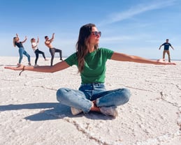 Funny photo on the Uyuni Salt Flat where Marine is holding us in her arms, using perspective play.