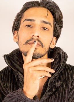 a man with a mustache and a mustache on his finger