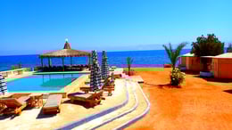 Beach with pool in front of the Red sea at Bedouin star Egypt