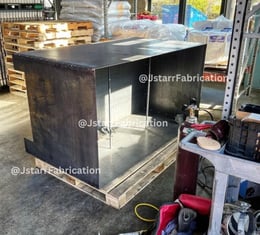 a unfinished metal planter box getting repaired