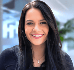 a woman with long hair and a black top