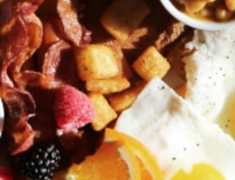 a breakfast plate with eggs, toasted eggs, and toasted eggs