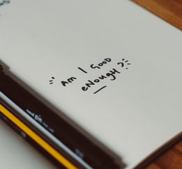 a notebook with a pencil and pencils on it