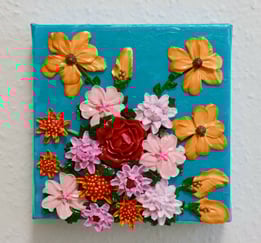 a painting of a flower arrangement on a blue background