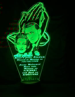 a green lighted up sign with a picture of a man and woman