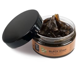 a jar of black soap with a black soap