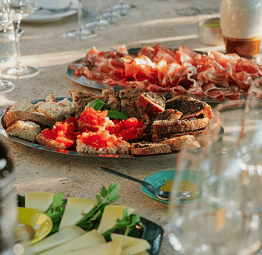 Traditional Italian antipasti with bruschetta, cheese and cured meats served during a soulful women’