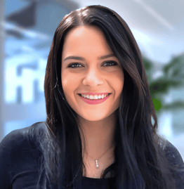a woman with long hair and a black top