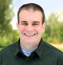 a man with a green shirt and a white shirt