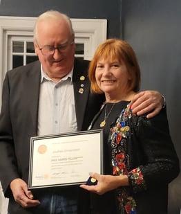 President Keith presents PDG Andrea with her Ruby PHF award