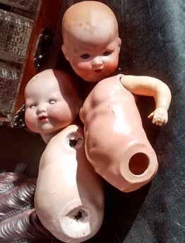 Photograph taken by the Chester UK Artist, Christine Gallagher showing 2 broken dolls