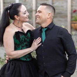 Carly and Kahn looking at each other lovingly at their vow renewal in Redlands.