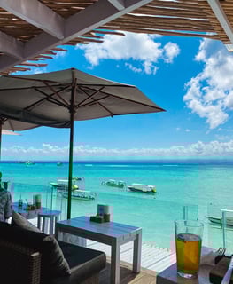 View of the turquoise lagoon waters of Nusa Lembongan from a café terrace.