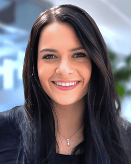 a woman with long hair and a black top