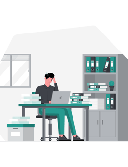 a man sitting at a desk with a laptop and a laptop