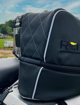 Remy rain cover folded compactly for storage, demonstrating portability and ease of use