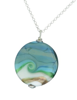 a necklace with a swirly sea design