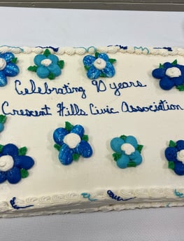 Cake decorated with words saying Celebrating 90 years Crescent Hills Civic Association