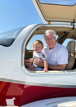 a man and a baby in a small plane