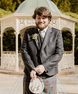 a man in a kiltrum kilt and a kilt