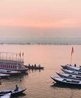 Numerous boats at sunrise on the Ganges River in Varanasi, India.