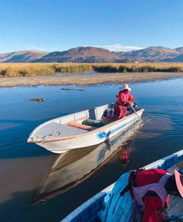 Peruvian woman on a boat on Lake Titicaca in Peru.