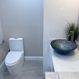 Vessel sink with waterfall faucet in ADU bathroom remodel