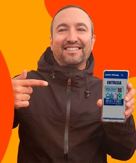a man holding a cell phone in his hand