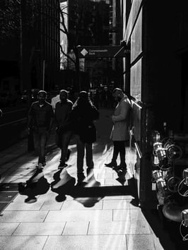 People make a play of light and shadow